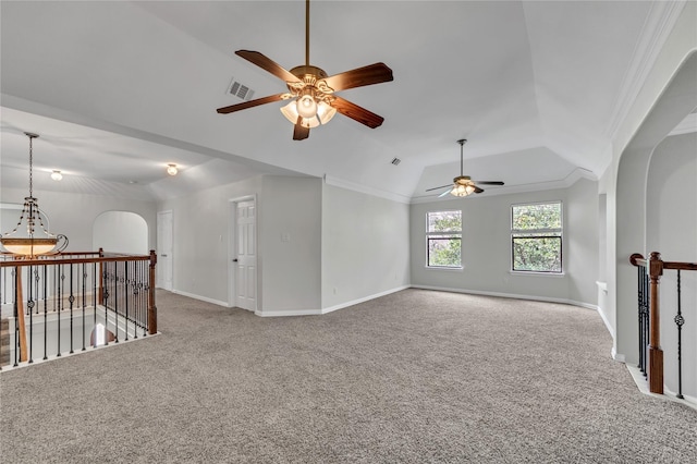 spare room featuring vaulted ceiling, ornamental molding, and carpet floors