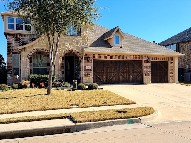 view of front of property with a garage