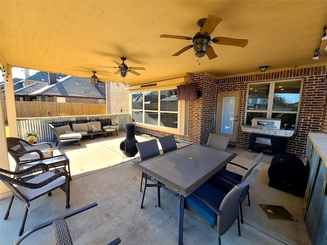 view of patio with grilling area, outdoor lounge area, and ceiling fan