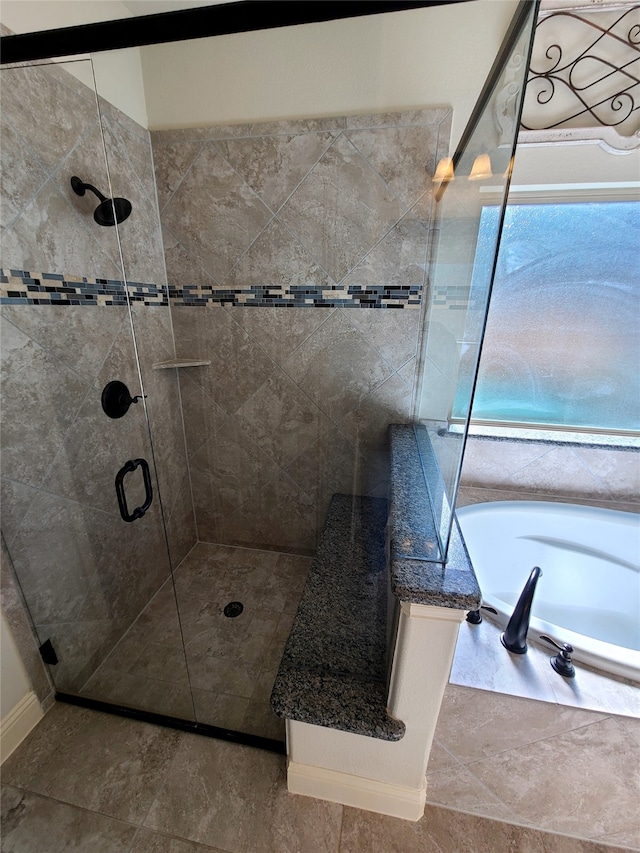 bathroom with separate shower and tub