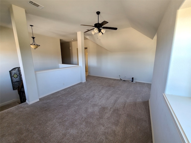 carpeted empty room featuring lofted ceiling and ceiling fan