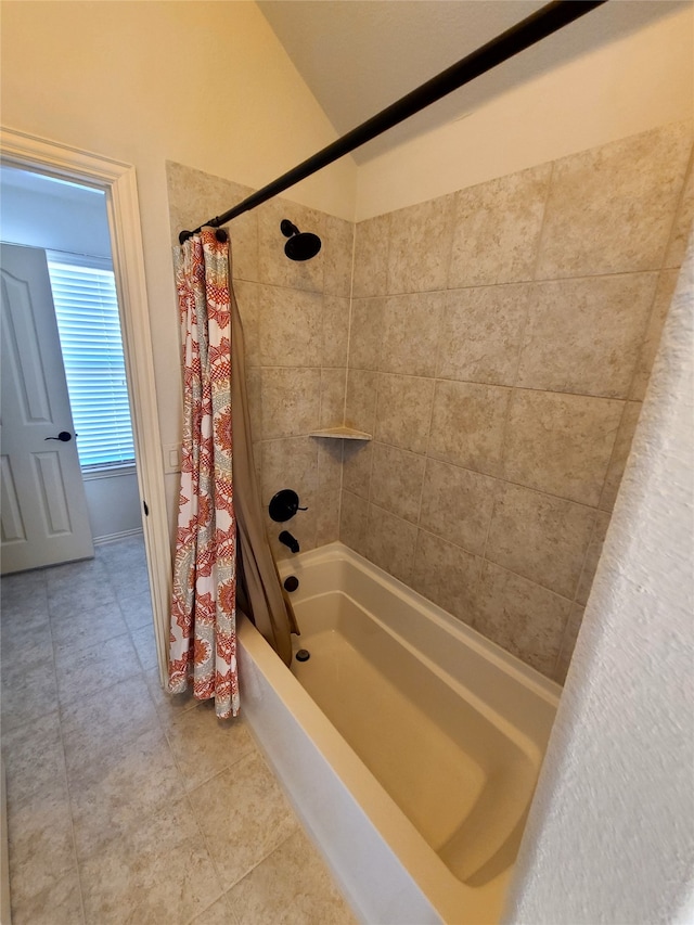 bathroom with tile patterned floors and shower / bathtub combination with curtain