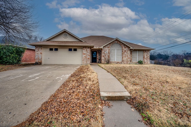 ranch-style home featuring a garage and a front yard