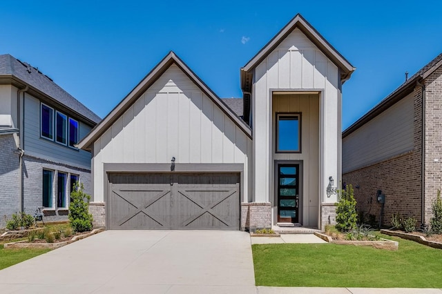 1533 Ginger Ln, Argyle, TX 76226 - view of front facade with board and batten siding, an attached garage, driveway, a front lawn, and brick siding