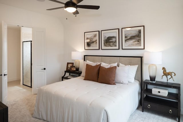 bedroom with ceiling fan, lofted ceiling, and light carpet