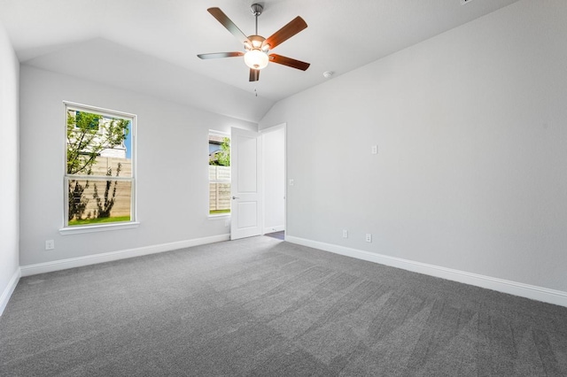 1533 Ginger Ln, Argyle, TX 76226 - empty room with vaulted ceiling, baseboards, dark carpet, and a ceiling fan