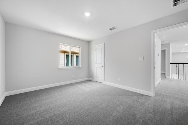1533 Ginger Ln, Argyle, TX 76226 - spare room featuring carpet, recessed lighting, baseboards, and attic access