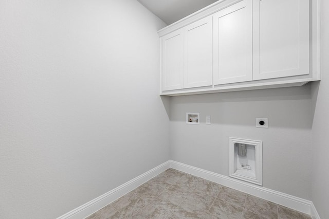 1533 Ginger Ln, Argyle, TX 76226 - laundry area with electric dryer hookup, cabinet space, washer hookup, and baseboards