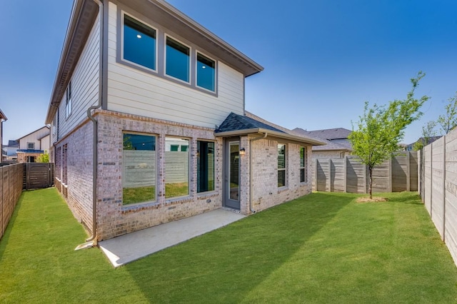 1533 Ginger Ln, Argyle, TX 76226 - back of house featuring brick siding and a patio area