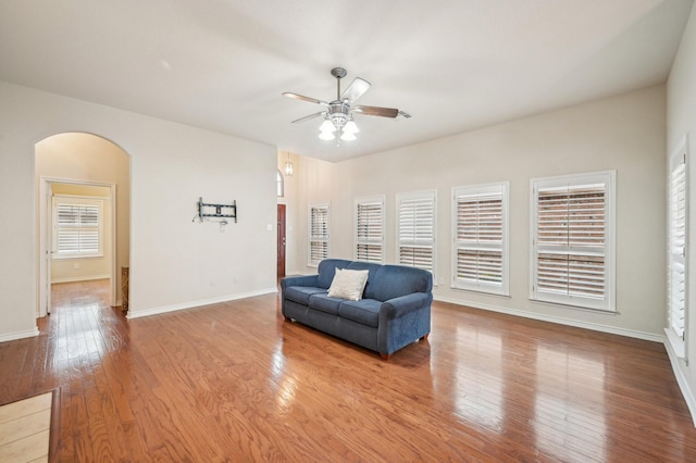 living area with hardwood / wood-style flooring and ceiling fan