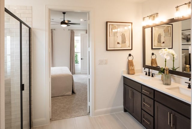 bathroom featuring vanity, ceiling fan, and walk in shower