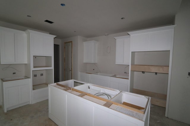 kitchen featuring white cabinetry and a kitchen island