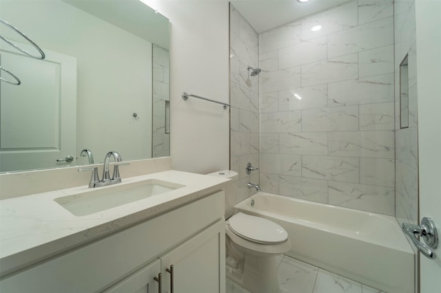 full bathroom featuring tiled shower / bath combo, vanity, and toilet