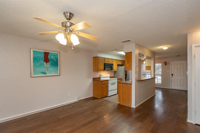 living room with dark wood-type flooring, a textured ceiling, and ceiling fan