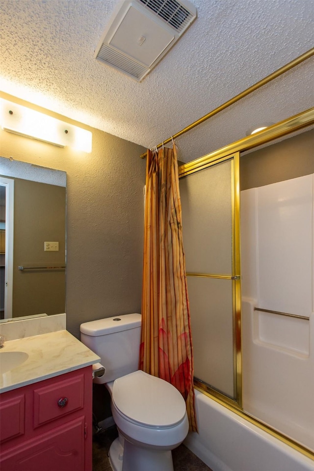 full bathroom with shower / tub combo with curtain, vanity, toilet, and a textured ceiling