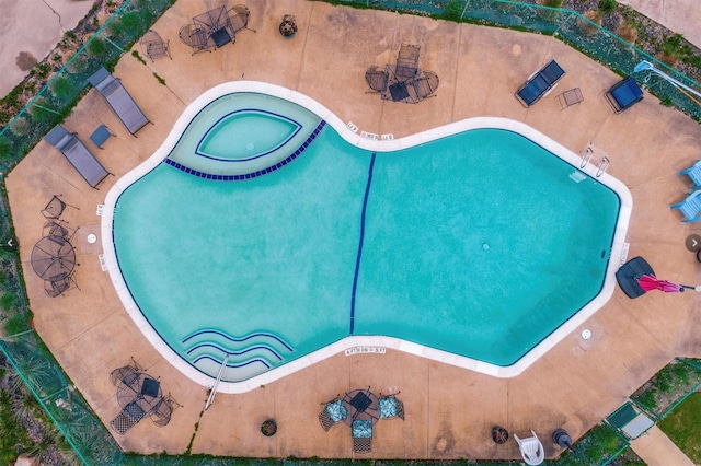 view of swimming pool with a jacuzzi