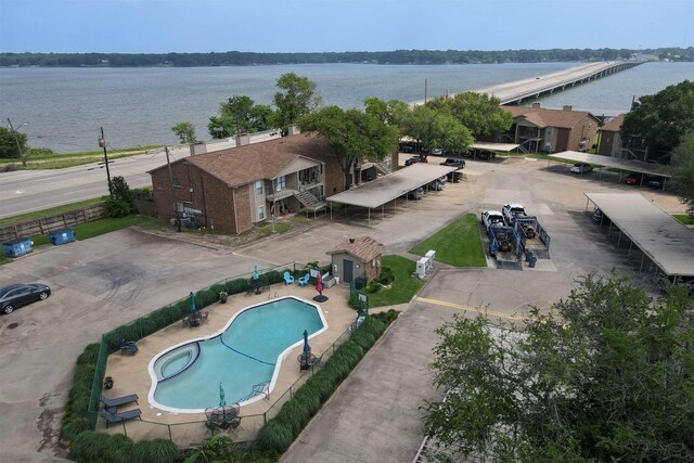 birds eye view of property with a water view