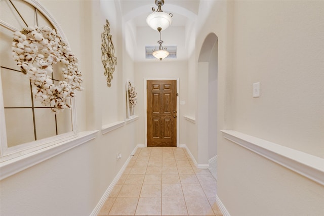 hallway featuring light tile patterned flooring