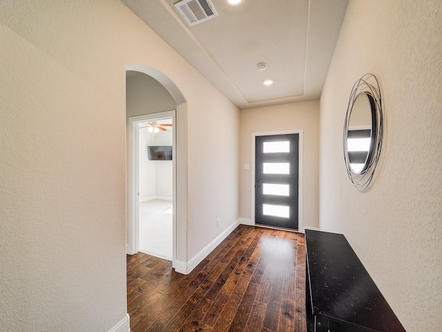 foyer with dark hardwood / wood-style flooring