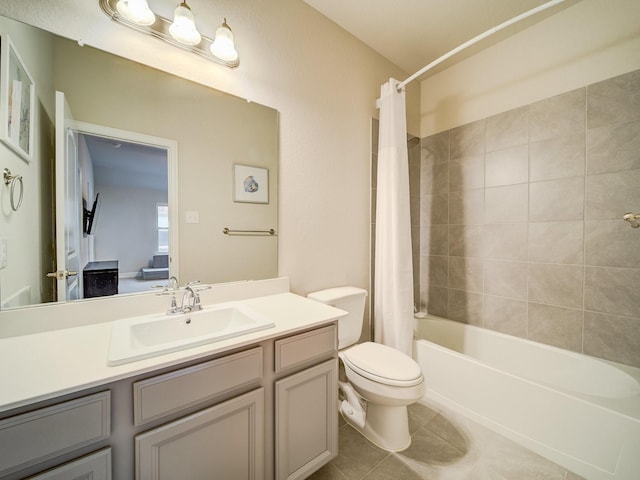 full bathroom with vanity, tile patterned floors, toilet, and shower / bath combo