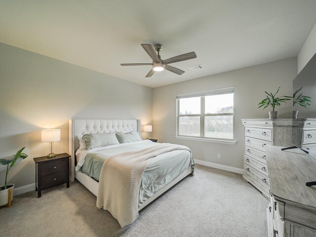 3124 Creek Meadow Dr, Anna, TX 75409 - bedroom with light carpet, baseboards, visible vents, and a ceiling fan