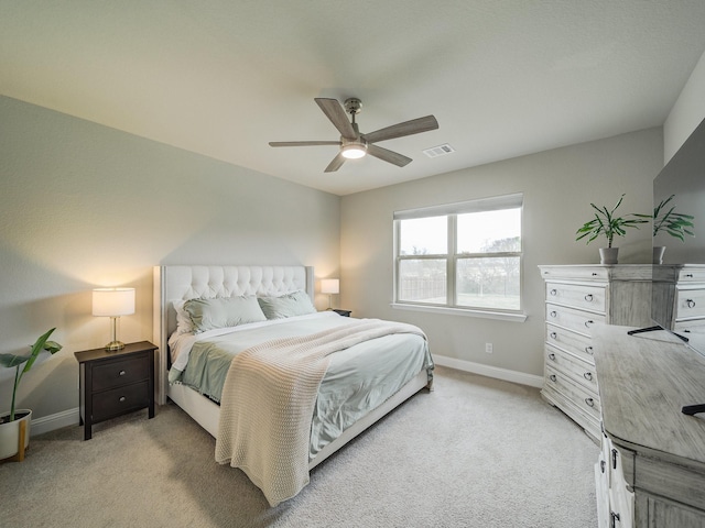 bedroom featuring light colored carpet and ceiling fan