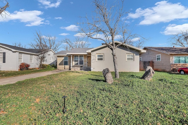 rear view of property featuring a yard