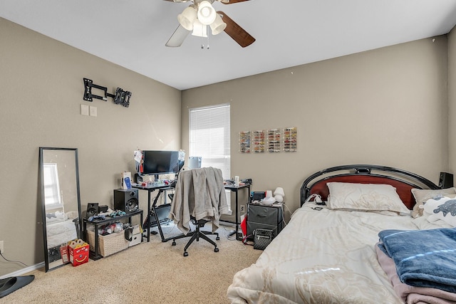 bedroom featuring light colored carpet and ceiling fan