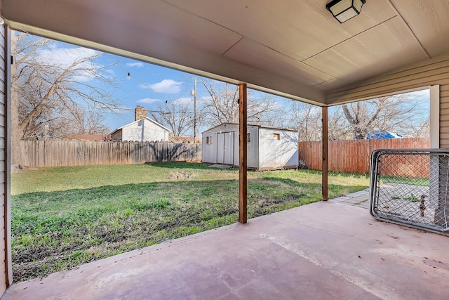 view of patio with a storage shed