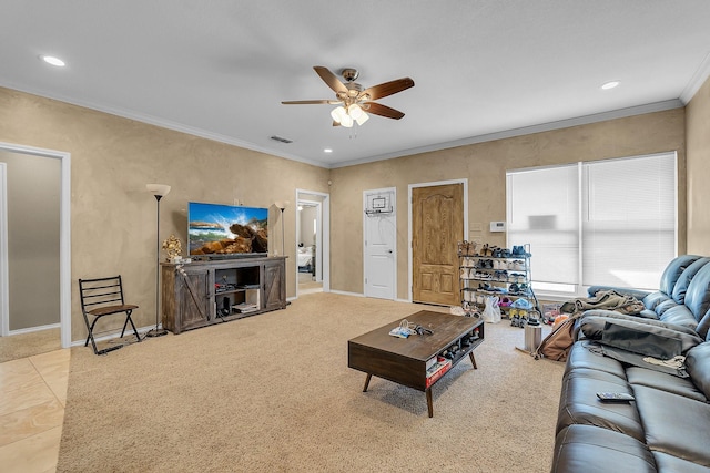 carpeted living room featuring ceiling fan and ornamental molding