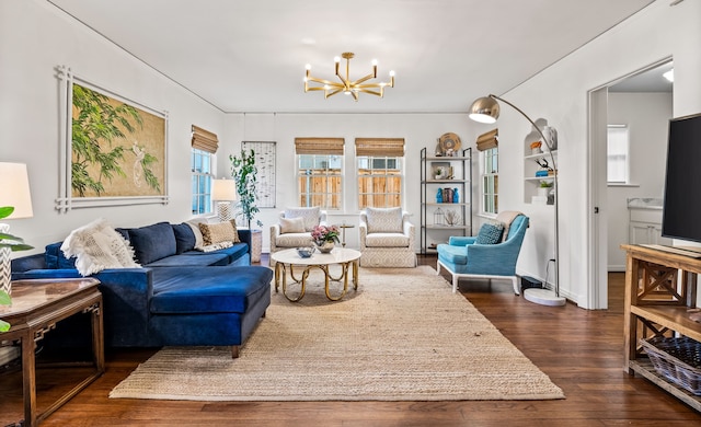 living room with dark wood-type flooring and a chandelier