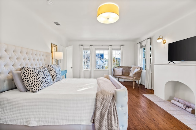 bedroom with hardwood / wood-style flooring