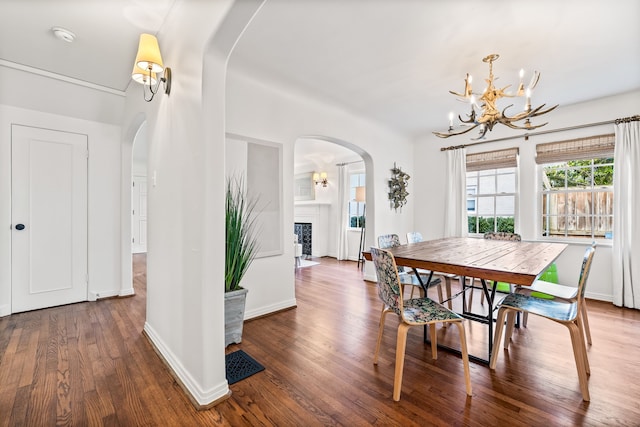 dining room featuring wood-type flooring and a notable chandelier