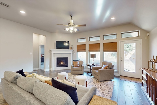 living room with lofted ceiling and ceiling fan