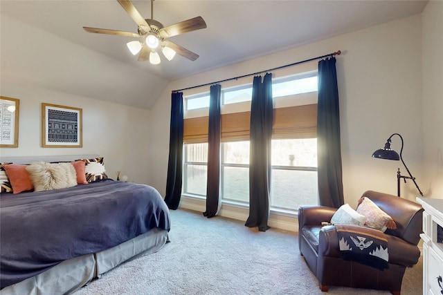 carpeted bedroom featuring ceiling fan and lofted ceiling