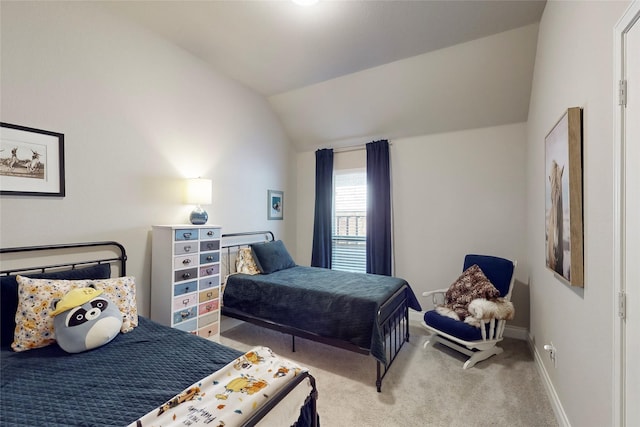 carpeted bedroom with vaulted ceiling