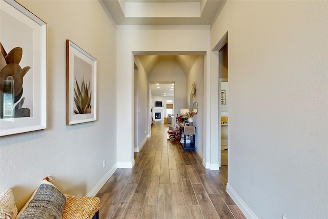 hallway with dark hardwood / wood-style floors