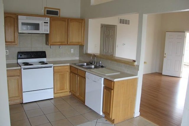 9514 Zelkova Cir, Dallas, TX 75249 - kitchen featuring light countertops, visible vents, a sink, and white appliances