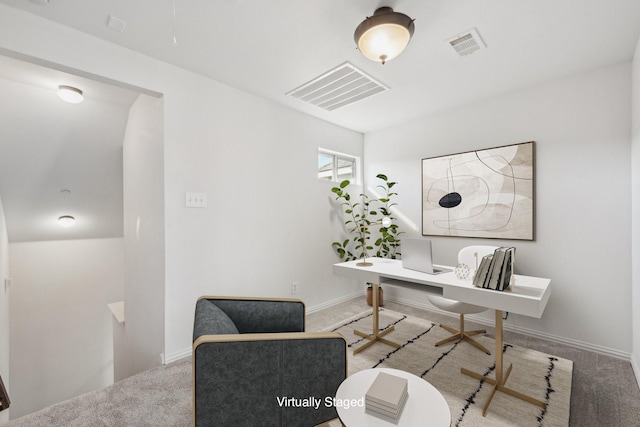 home office featuring light carpet, baseboards, and visible vents