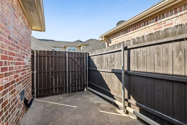 view of patio / terrace with fence and a gate