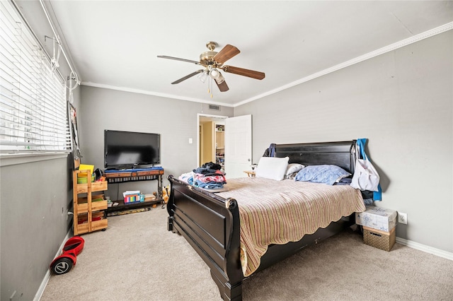 carpeted bedroom featuring crown molding and ceiling fan