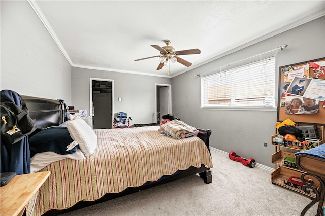 carpeted bedroom featuring crown molding and ceiling fan