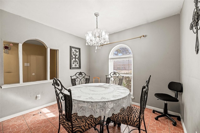 dining area featuring an inviting chandelier