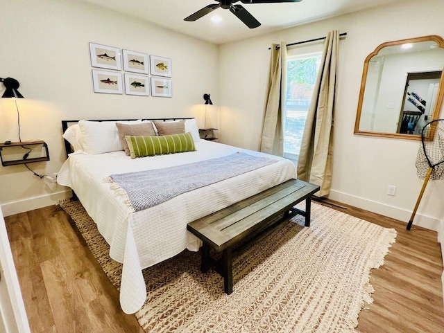 bedroom with ceiling fan and light wood-type flooring