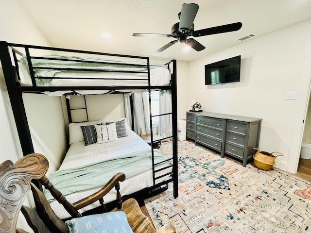 bedroom with ceiling fan and light hardwood / wood-style flooring