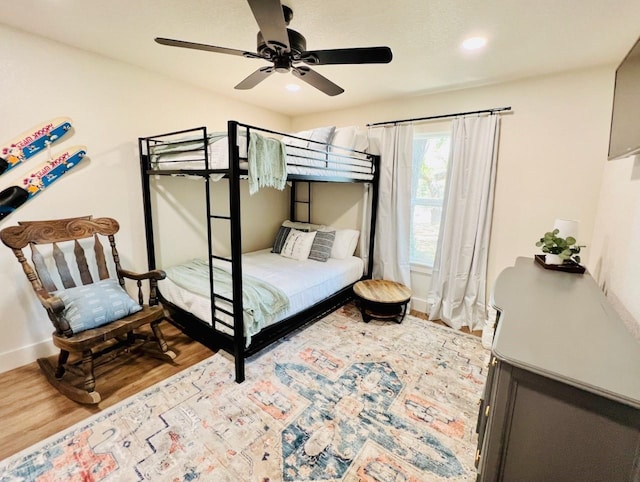 bedroom with hardwood / wood-style flooring and ceiling fan