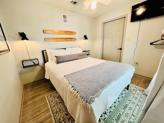 bedroom featuring hardwood / wood-style floors and ceiling fan