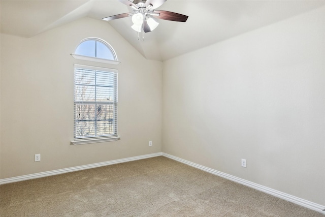 carpeted empty room with lofted ceiling and ceiling fan