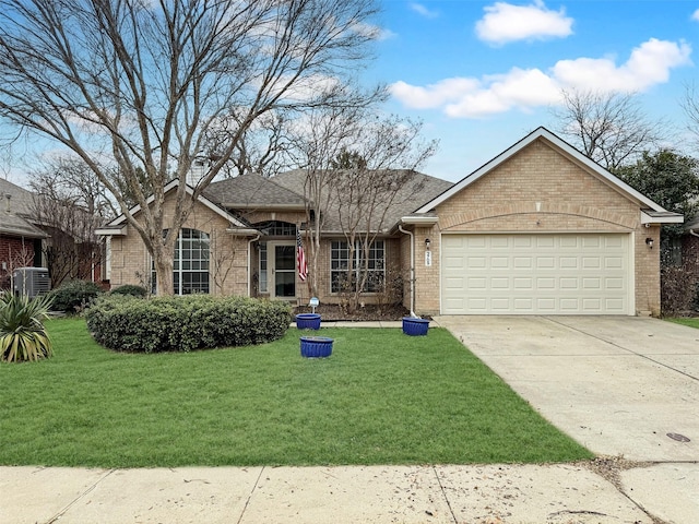 single story home featuring a garage and a front yard