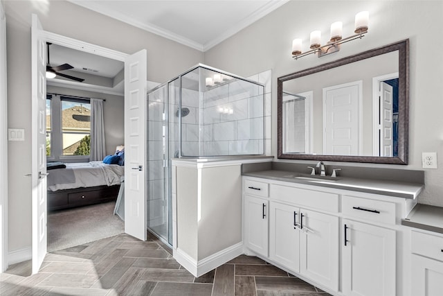 bathroom with vanity, crown molding, a stall shower, and ensuite bathroom